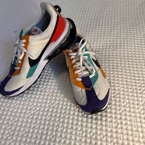 Nike White Sneakers with Black Insole and Red Swoosh Accent